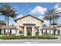 Community clubhouse with stone exterior and palm trees at 125 Soliera St, Nokomis, FL 34275