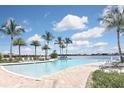 Resort-style pool with lake views and lounge chairs at 125 Soliera St, Nokomis, FL 34275