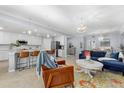 Open floor plan with modern kitchen, spacious living area, and stylish furnishings at 12530 Ghiberti Cir # 102, Venice, FL 34293