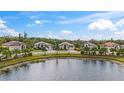 Aerial view of a luxury home community with lakefront properties at 187 Nolen Dr, Venice, FL 34292