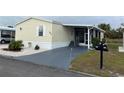 Mobile home with paved driveway and mailbox at 223 Roma Rd, Venice, FL 34285