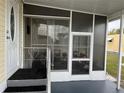 Spacious screened porch with seating area at 223 Roma Rd, Venice, FL 34285