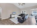 Spacious living room with leather couches and hardwood floors at 3328 Waterloo Ter, North Port, FL 34286