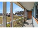 Bright screened porch overlooks the neighborhood at 370 Waltham St, Port Charlotte, FL 33952