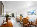 Dining area with table and chairs, open to living room at 404 Cerromar N Cir # 116, Venice, FL 34293
