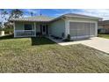 One-story house with garage and porch at 6502 Whelan St, Englewood, FL 34224