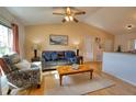 Living room with gray couch, coffee table, and hardwood floors at 7148 Totem Ave, North Port, FL 34291