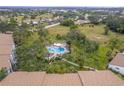 Complex featuring a refreshing pool, surrounded by lush greenery at 832 Bird Bay Way # 113, Venice, FL 34285