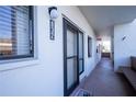 Condo building exterior showcasing entrance and hallway at 832 Bird Bay Way # 113, Venice, FL 34285