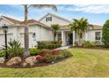 House exterior showcasing landscaping and walkway at 11678 Aucilla Dr, Venice, FL 34293