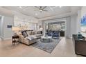 Spacious living room with comfortable seating and large windows at 11678 Aucilla Dr, Venice, FL 34293