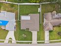 Top-down view showcasing a single-story house and surrounding homes at 1236 Pinebrook Way, Venice, FL 34285