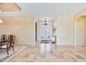Spacious entryway with tile flooring and a view of the double doors at 1348 Reserve Dr, Venice, FL 34285
