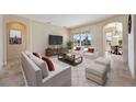 Bright living room with access to the pool and patio at 1348 Reserve Dr, Venice, FL 34285