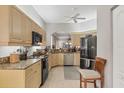 Kitchen with granite countertops and stainless steel appliances at 1647 Lancashire Dr # 1647, Venice, FL 34293