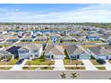 Aerial view showcasing the property's location in a residential community at 16766 Carlton Pond St, Wimauma, FL 33598