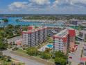 Aerial view of condo complex near marina, showcasing the pool at 244 Saint Augustine Ave # 805, Venice, FL 34285