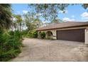 Brown double garage door and a paved driveway at 2542 Northway Dr, Venice, FL 34292