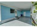 Light blue mobile home exterior with covered carport and small yard at 356 Longwood Dr, Venice, FL 34285