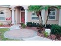 Inviting front entry with brick pavers, landscaping, and a stately entrance at 4081 Roderigo Ave, North Port, FL 34286