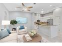 Open concept kitchen and living area with granite countertops at 4575 Cancello Grande Ave, Venice, FL 34293