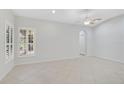 Spacious bedroom with large windows and tile flooring at 4575 Cancello Grande Ave, Venice, FL 34293