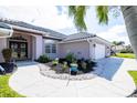 Welcoming walkway leading to double entry doors at 521 Pennyroyal Pl, Venice, FL 34293
