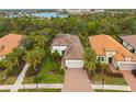 Luxury home community with lush landscaping and a lake view at 5592 Semolino St, Nokomis, FL 34275
