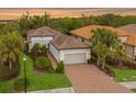 Beautiful one-story home with a tile roof and landscaped yard at 5592 Semolino St, Nokomis, FL 34275