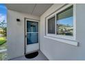 Condo entry with screen door and window at 649 Tamiami S Trl # 107, Venice, FL 34285