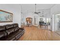 Open living and dining area with hardwood floors and ample natural light at 652 Linden Dr, Englewood, FL 34223
