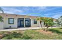 Neat and clean exterior of the property at 6796 Gasparilla Pines Blvd # 13, Englewood, FL 34224