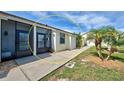 Front entrance of the property with walkway at 6796 Gasparilla Pines Blvd # 13, Englewood, FL 34224