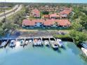 Aerial view of condo building with private boat docks at 738 Sorrento Inlt # 738, Nokomis, FL 34275