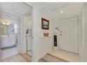 Bright condo entry with access to laundry and bathroom at 817 Montrose Dr # 103, Venice, FL 34293