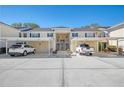 Condo building with covered parking and landscaping at 817 Montrose Dr # 103, Venice, FL 34293