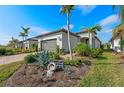 One-story house with a two-car garage and nicely landscaped yard at 13756 Vadini St, Venice, FL 34293