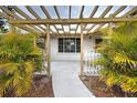 Front entrance with pergola and walkway at 151 Morningside Rd, Venice, FL 34293