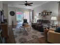 Spacious living room with comfy seating and hardwood floors at 1890 San Trovaso Way, Venice, FL 34285