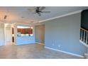 Open living area with tile floors and neutral color palette at 20234 Lagente Cir, Venice, FL 34293