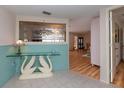 Glass-top console table and swan-shaped base in a living room at 315 Park N Blvd, Venice, FL 34285