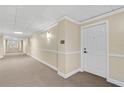 Clean hallway with carpeted floors and neutral wall colors at 3730 Cadbury Cir # 300, Venice, FL 34293