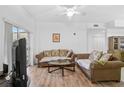 Living room with hardwood floors, two sofas, and a coffee table at 3730 Cadbury Cir # 300, Venice, FL 34293
