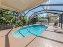 Relaxing screened pool with ample patio space at 601 E Seminole Dr, Venice, FL 34293