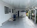 Covered patio with table and chairs, offering shaded outdoor space at 607 Cervina Dr, Venice, FL 34285