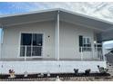 Front view of a mobile home, showcasing its exterior features at 723 Locarno Dr, Venice, FL 34285