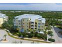 Aerial view of building and waterfront property at 10501 Amberjack Way # 103, Englewood, FL 34224