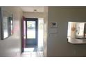 Bright entryway with tile floors and access to kitchen at 112 Jose Gaspar Dr # 112, Englewood, FL 34223