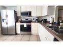 Well-equipped kitchen featuring stainless steel appliances at 112 Jose Gaspar Dr # 112, Englewood, FL 34223