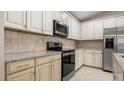 Updated kitchen featuring granite countertops and stainless steel appliances at 12460 Shimmering Oak Cir, Venice, FL 34293